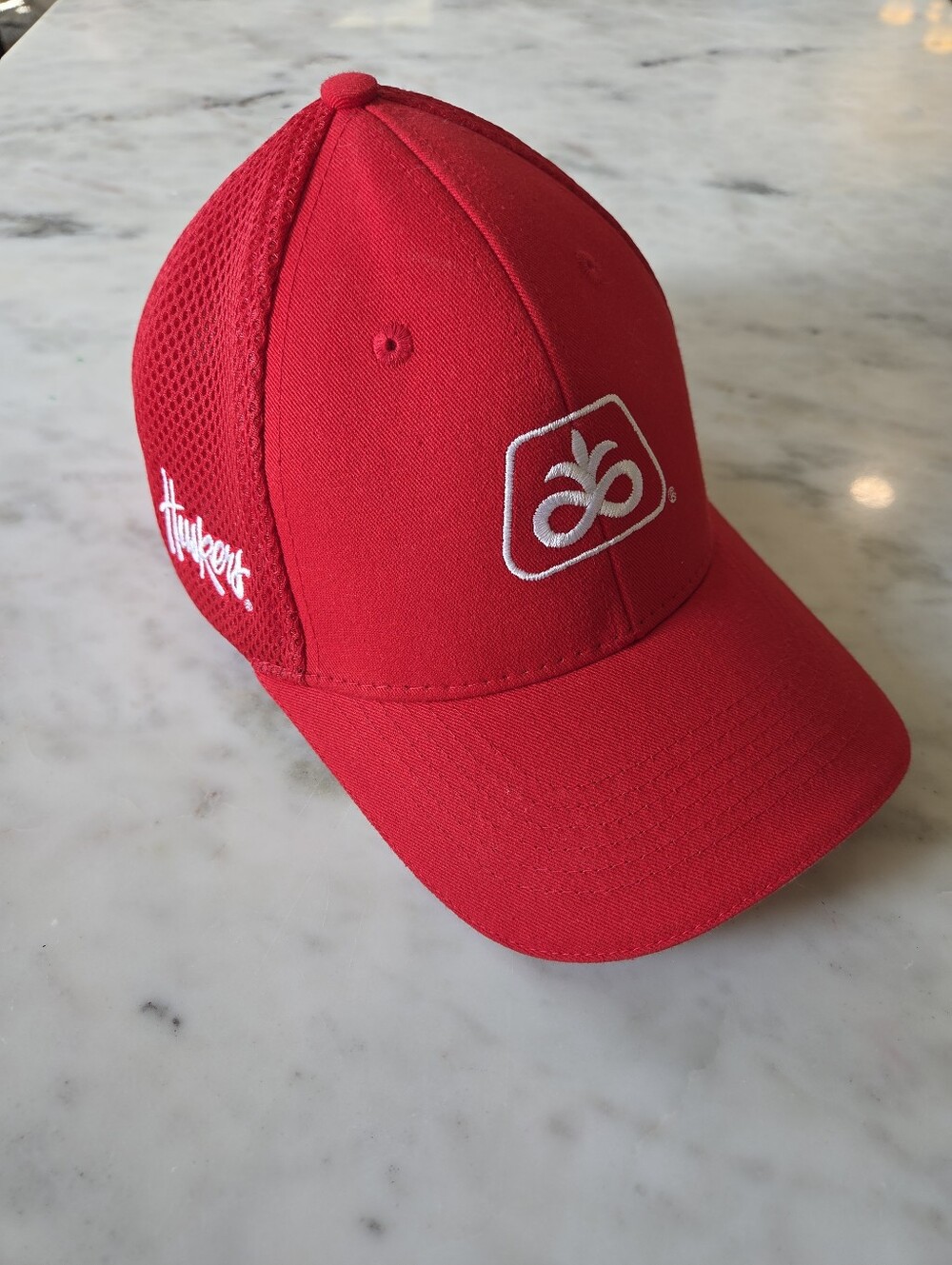 Red Baseball Cap Featuring White Pioneer and Husker Logos